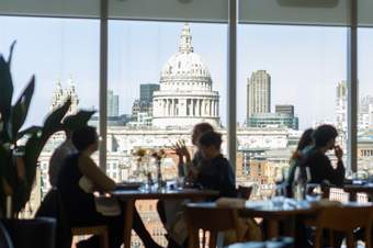 View of St Pauls Cathedral from a busy restaurant